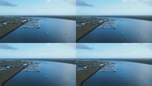 位于巴镇的一个受保护港口停靠的多艘船只的高曝光无人机视图高清在线视频素材下载