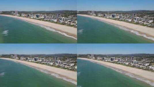 田园诗般的海滩，白天有海滨酒店和公寓楼-棕榈滩，昆士兰，澳大利亚高清在线视频素材下载