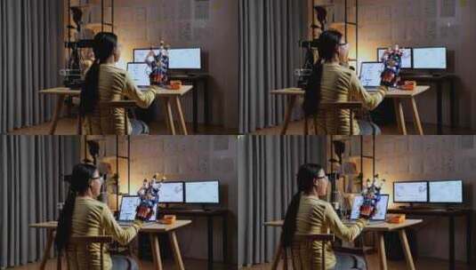 3D打印的亚洲少女在家里的笔记本电脑上设计时检查电子人的手高清在线视频素材下载