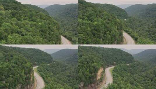 航拍山坡上的公路高清在线视频素材下载