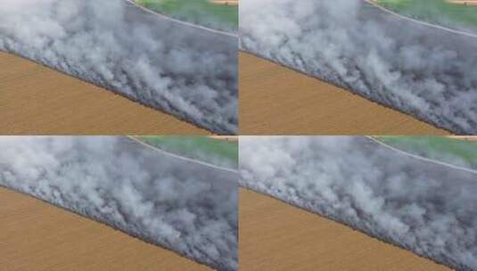 燃烧的农田和烟雾高清在线视频素材下载