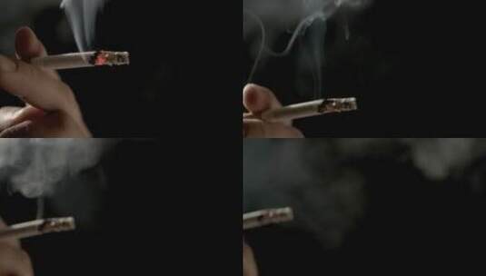 黑色背景上手持呼出烟雾的香烟高清在线视频素材下载
