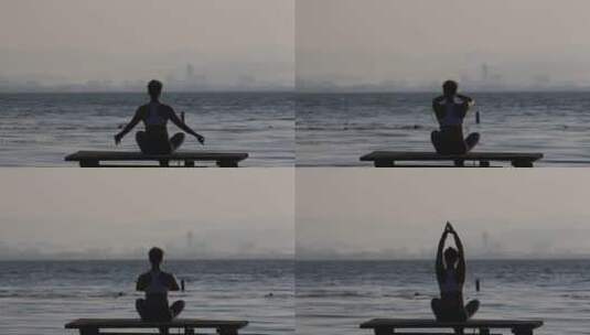 湖边练瑜珈的女性高清在线视频素材下载