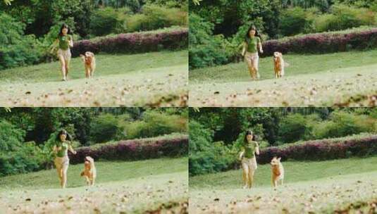 美女和宠物狗金毛犬在公园里玩耍奔跑慢镜头高清在线视频素材下载