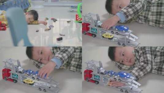 地板上玩玩具汽车的小男孩高清在线视频素材下载