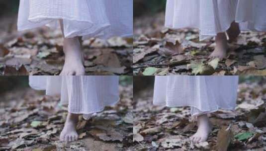 穿着长裙的女孩赤脚在落叶上行走4k视频素材高清在线视频素材下载