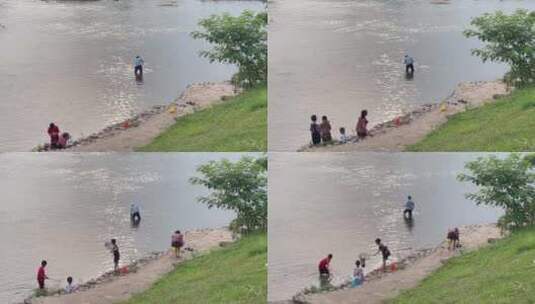 枯水期浅水区河水捞鱼游玩戏水的人高清在线视频素材下载