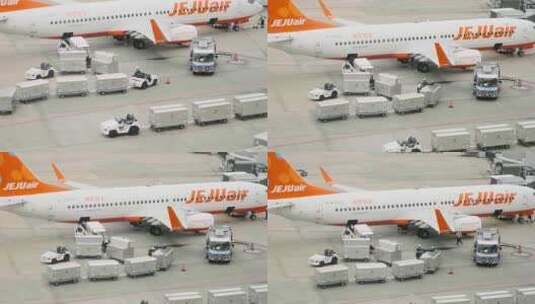 日本成田机场工作人员飞机旁忙碌的场景高清在线视频素材下载