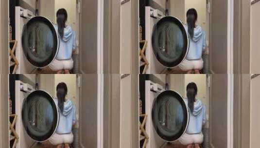 亚洲美女用洗衣机洗衣服高清在线视频素材下载