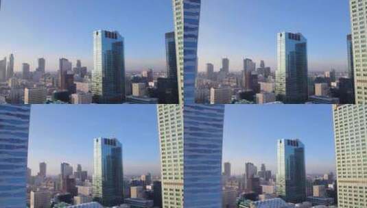 阳光下摩天大楼的市区航拍高清在线视频素材下载