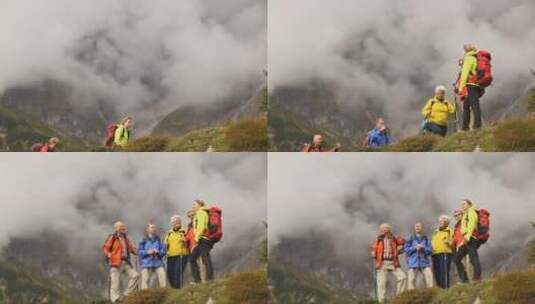 一群老年人登山时眺望远方高清在线视频素材下载