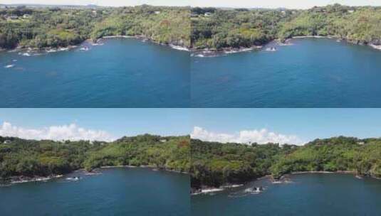 俯冲拍摄海面上的绿荫孤岛高清在线视频素材下载