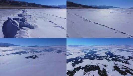 航拍新疆冬季赛里木湖冰封湖面雪山冰湖积雪高清在线视频素材下载