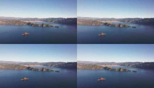 云南丽江泸沽湖湖中的岛屿日落黄昏航拍实时高清在线视频素材下载