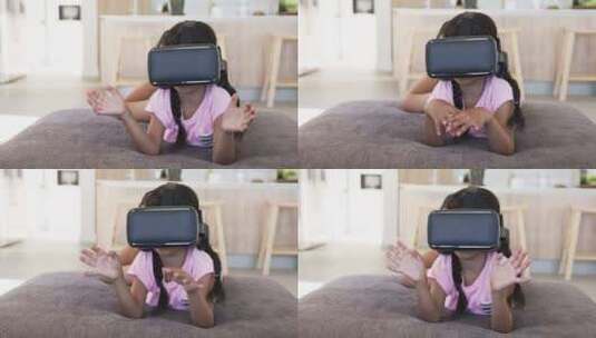 戴着VR耳机的出生女孩体验虚拟现实，双手高清在线视频素材下载