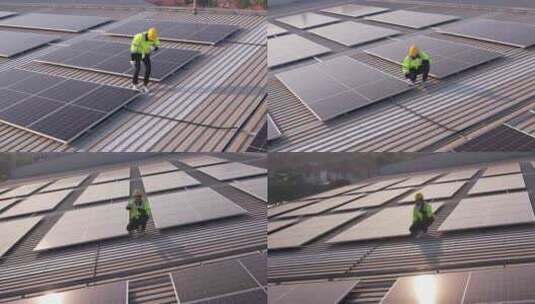 工程师工人在屋顶安装太阳能电池板的无人机高清在线视频素材下载