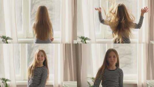 小女孩窗户摇晃健康的头发去看相机微笑的孩高清在线视频素材下载
