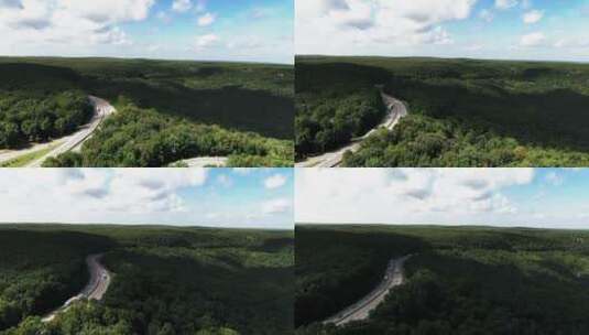 航拍森林中的高速公路高清在线视频素材下载