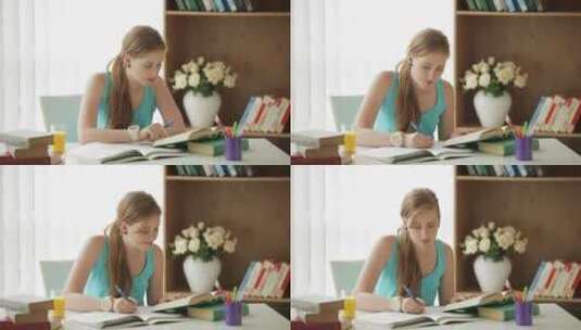 在桌子上写作业的女人高清在线视频素材下载