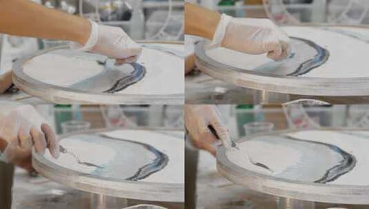 在环氧树脂盘上使用刮刀作画高清在线视频素材下载