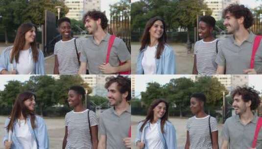 三个快乐的多种族年轻朋友在城市散步时闲逛高清在线视频素材下载