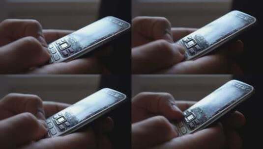 特写男性手正在使用过去的旧按钮手机高清在线视频素材下载