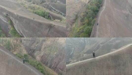 高椅岭刀背山顶无人机航拍男人站在山脊悬崖高清在线视频素材下载