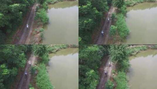 武汉梁子湖山路骑行双人俯拍航拍高清在线视频素材下载