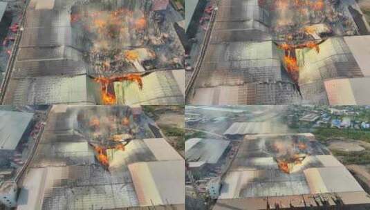 一场大火吞噬一座工业建筑的鸟瞰图。高清在线视频素材下载