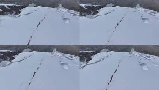 航拍冰川之父慕士塔格峰雪山冰川上的登山队高清在线视频素材下载