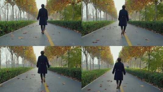 秋天独自走在公园小路上的中国女性高清在线视频素材下载