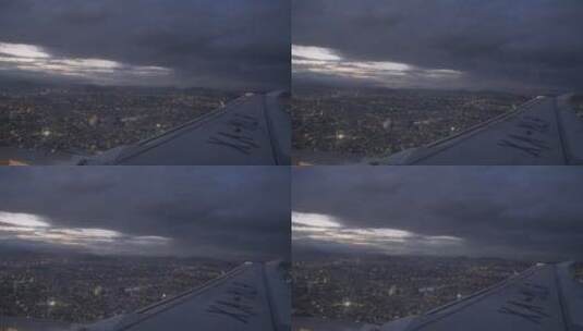 夜间飞越城市上空的飞机高清在线视频素材下载