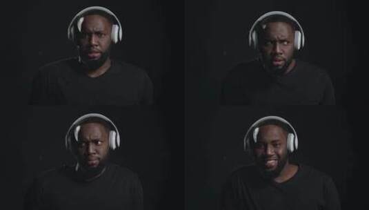 非洲男人听耳机里的音乐高清在线视频素材下载