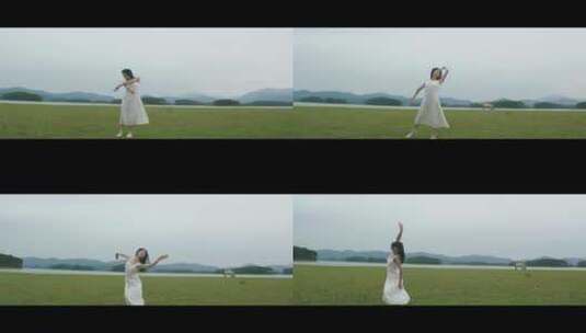 白色连衣裙女子在草原上跳舞高清在线视频素材下载
