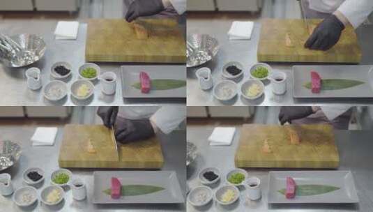 厨房里切割小鲑鱼的厨师高清在线视频素材下载