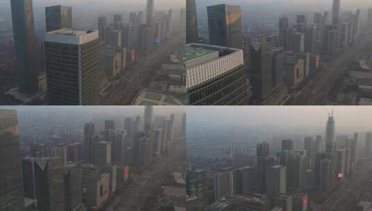 航拍晨雾中城市高楼和繁忙的交通高清在线视频素材下载