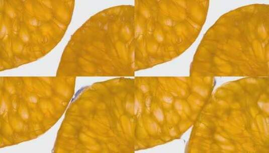 将两个多汁的柑橘瓣粉碎高清在线视频素材下载