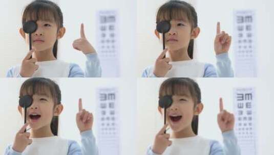 可爱的小女孩测试视力高清在线视频素材下载