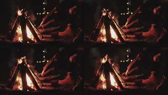 一家人户外露营坐在篝火旁取暖高清在线视频素材下载
