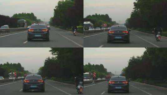 国道上行驶的黑色别克君威小轿车高清在线视频素材下载