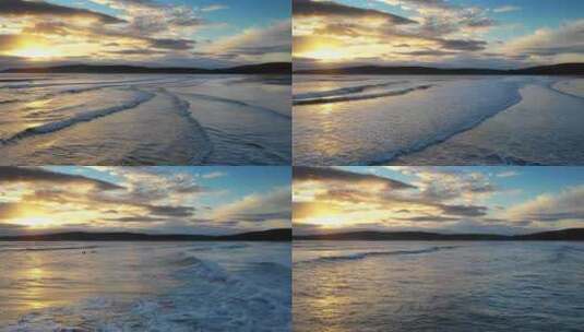 航拍大海夕阳黄昏海浪拍打沙滩海边冲浪高清在线视频素材下载