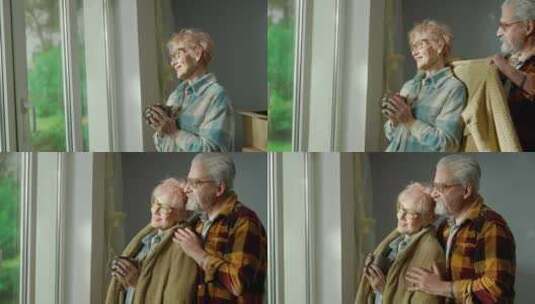 老年男子用布包裹着一名老年妇女高清在线视频素材下载