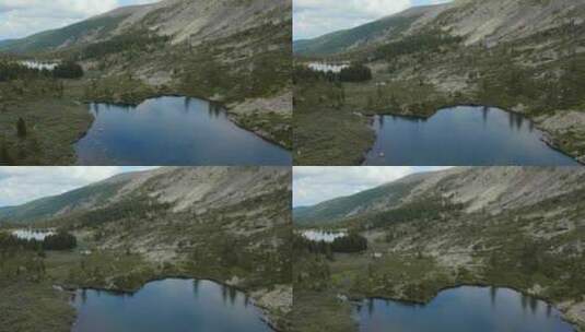 蓝天下的湖泊和森林高清在线视频素材下载
