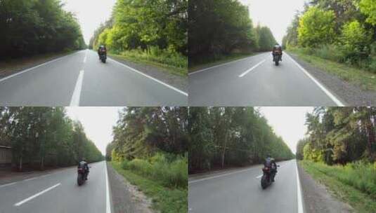 摩托车手在伍德兰乡村公路上骑摩托车比赛，高清在线视频素材下载