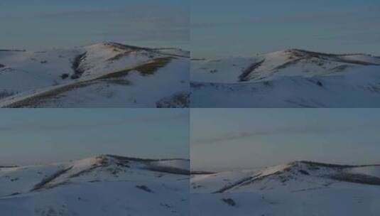 横移航拍阳光洒在白雪皑皑的山脉高清在线视频素材下载