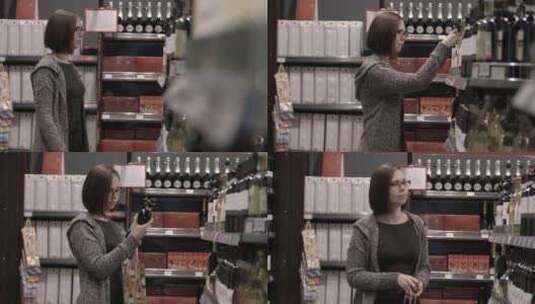 一个女人买葡萄酒作为礼物高清在线视频素材下载