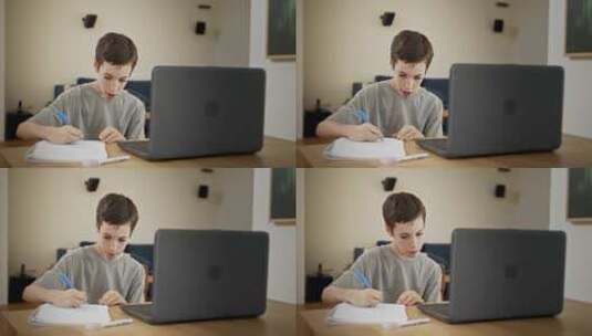 在电脑前写作业男孩高清在线视频素材下载