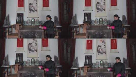 中式四合院胡同女人欣赏瓷碗高清在线视频素材下载