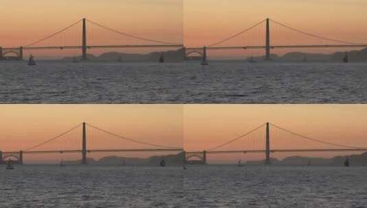 日落时金门大桥前的帆船高清在线视频素材下载