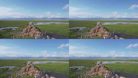 航拍新疆巴音布鲁克草原上五彩经幡景观高清在线视频素材下载